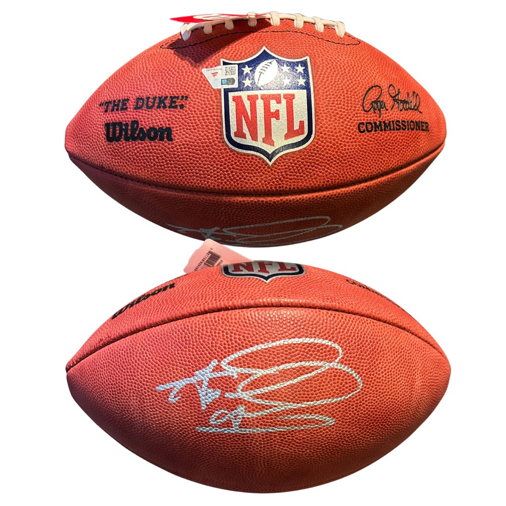 Two views of the same Tua Tagovailoa signed football