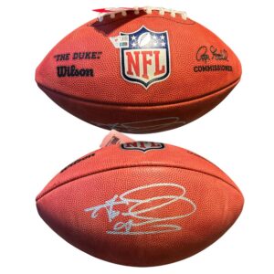 Two original photographs of the same Tua Tagovailoa signed Wilson Duke football, showing its markings and autograph